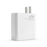 A white Xiaomi 67W wall charger with two silver metal pins, shown on a clean white background. The front of the charger features the text '67W', 'Xiaomi Communications Co.