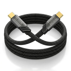 A coiled black braided HDMI cable with gold-toned USB-C connectors, featuring visible branding on the connector housings, set against a clean white background.
