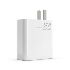 A white Xiaomi 67W wall charger with two silver metal pins, shown on a clean white background. The front of the charger features the text '67W', 'Xiaomi Communications Co.