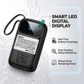 A black 120W smart LED digital battery pack with a wrist strap and a built-in display screen, shown on a light gray background with circuit board graphics and feature callouts.